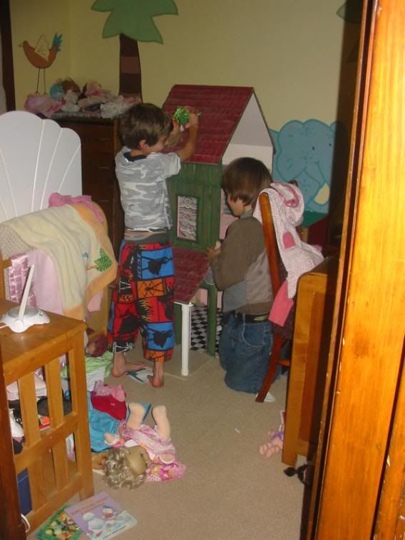 caught the boys playing with Tisha's new dollhouse